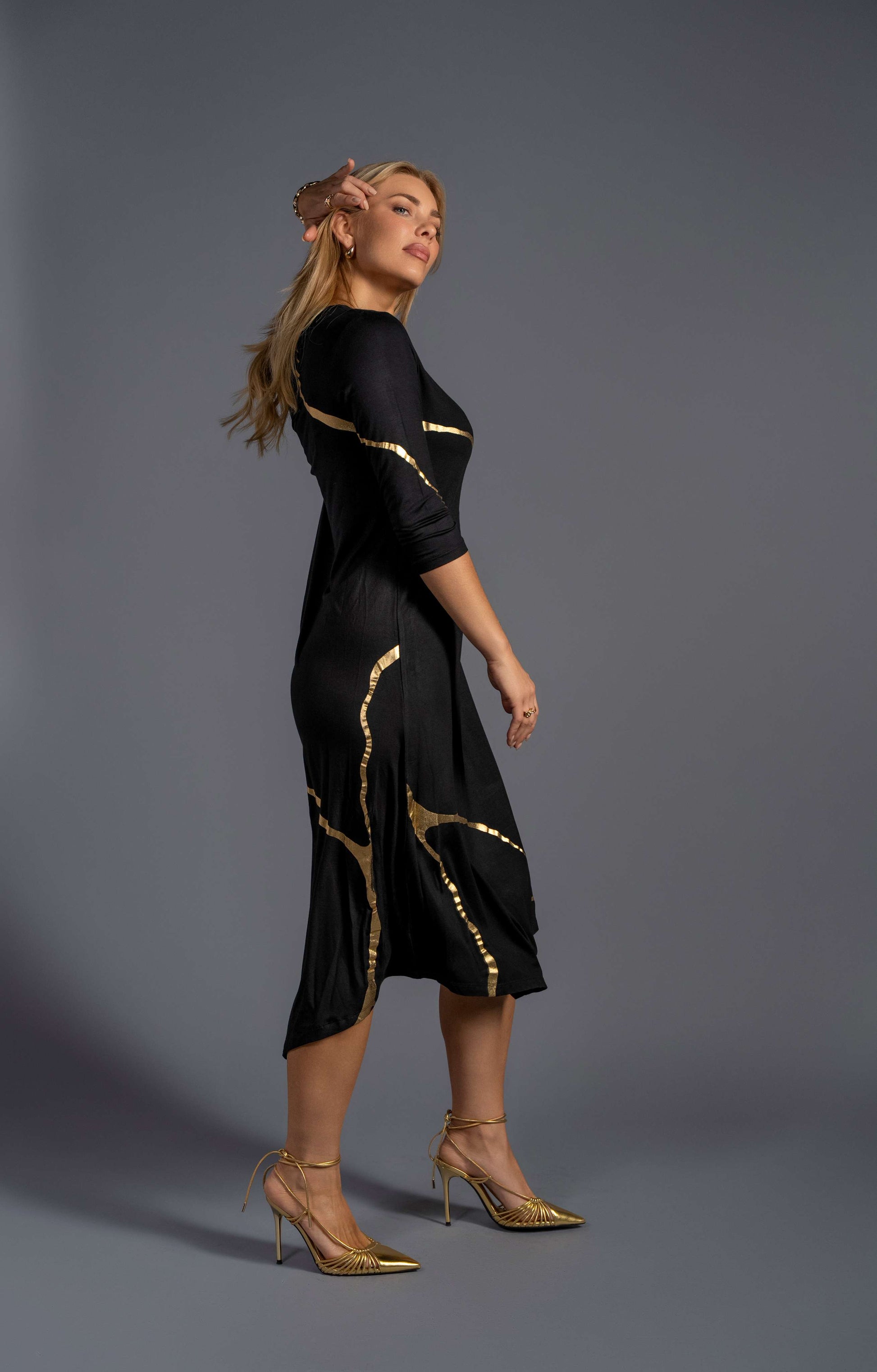 black dress with gold foil Black tulle dress adorned with intricate gold embroidery with a dramatic black silk taffeta overskirt